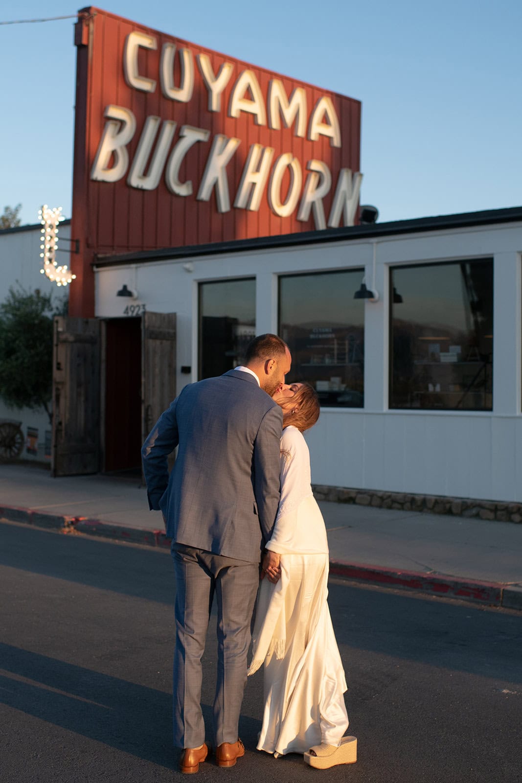 couple kissing at a small intimate wedding